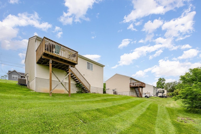 92 High St, Walton, KY 41094 - rear view of house featuring stairway, a deck, a yard, and central AC