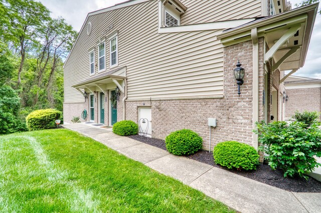 5913 Boulder Vw, Cold Spring, KY 41076 - view of home's exterior with brick siding and a yard