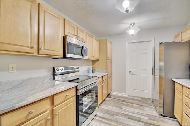 5913 Boulder Vw, Cold Spring, KY 41076 - kitchen featuring stainless steel appliances, light brown cabinetry, light wood finished floors, and light stone counters