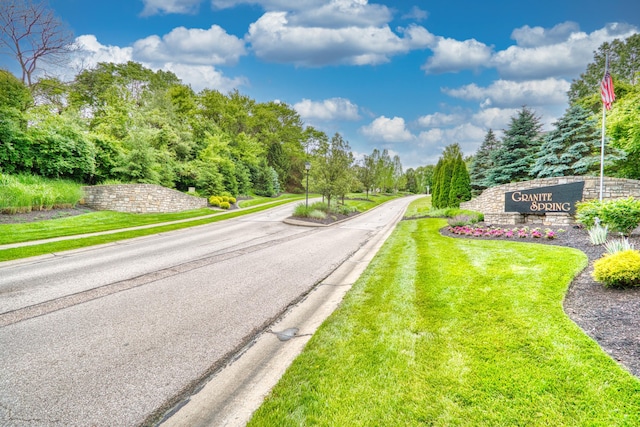 5913 Boulder Vw, Cold Spring, KY 41076 - view of asphalt road with curbs, sidewalks, view of wooded area, and street lighting