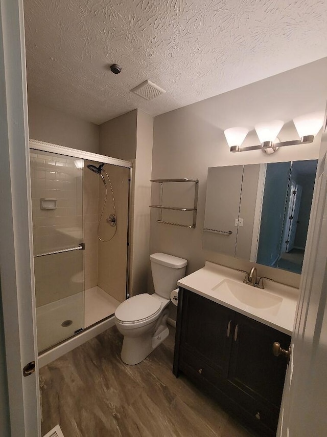 122 Whitney Ct, Crestview Hills, KY 41017 - full bath featuring wood finished floors, vanity, a shower stall, and a textured ceiling
