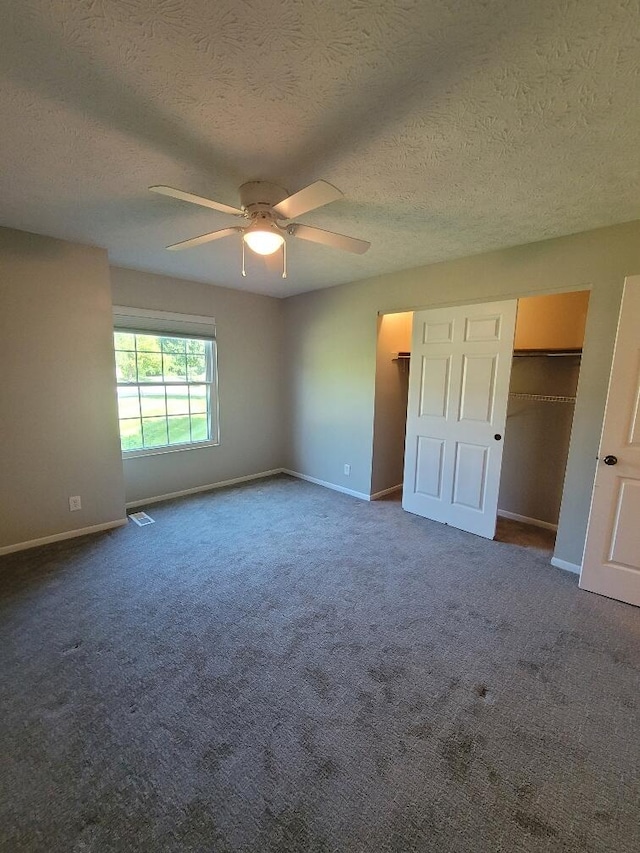 122 Whitney Ct, Crestview Hills, KY 41017 - unfurnished bedroom with a textured ceiling, dark carpet, and ceiling fan