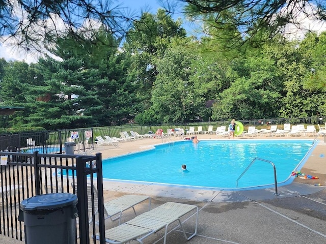 122 Whitney Ct, Crestview Hills, KY 41017 - community pool featuring a patio area and view of wooded area
