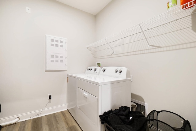 8492 Concerto Ct, Union, KY 41091 - laundry area with independent washer and dryer, electric panel, light wood-type flooring, and baseboards