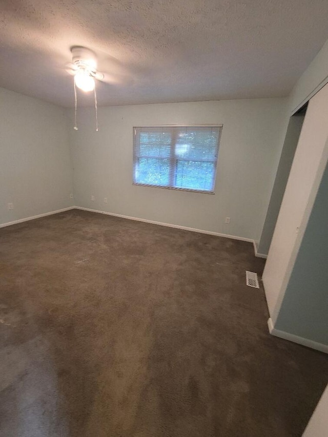 218 Shaker Heights Ln, Crestview Hills, KY 41017 - empty room featuring ceiling fan, a textured ceiling, and dark carpet