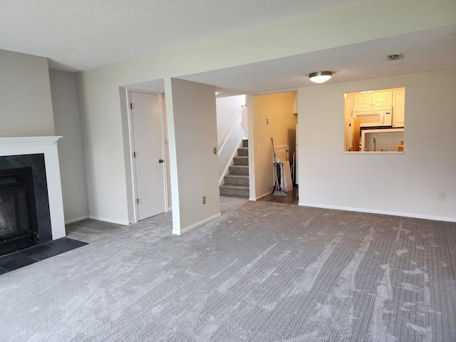 152 Steelway Farm Ct, Crestview Hills, KY 41017 - unfurnished living room featuring carpet flooring, stairway, and a fireplace