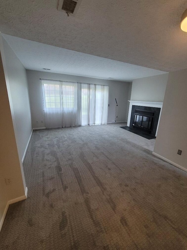 152 Steelway Farm Ct, Crestview Hills, KY 41017 - unfurnished living room featuring carpet, a textured ceiling, and a fireplace with flush hearth