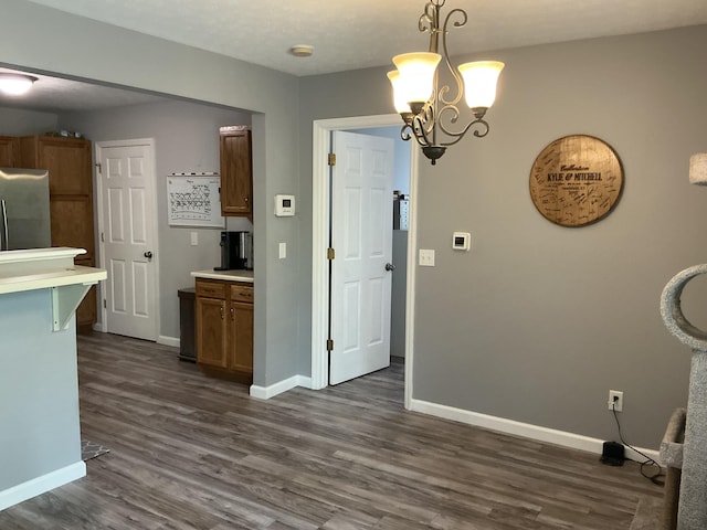 351 Deepwoods Dr, Newport, KY 41076 - kitchen with stainless steel refrigerator, dark wood-style floors, light countertops, and baseboards