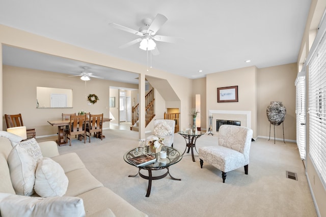 1622 Castle Hill Ln, Fort Wright, KY 41011 - living area featuring light carpet, stairs, baseboards, ceiling fan, and recessed lighting