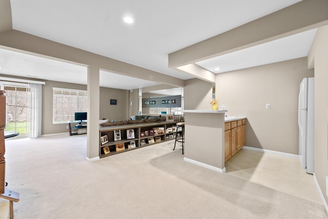 1622 Castle Hill Ln, Fort Wright, KY 41011 - bar area with freestanding refrigerator, light carpet, baseboards, and recessed lighting