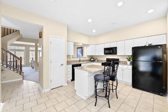 1622 Castle Hill Ln, Fort Wright, KY 41011 - kitchen with black appliances, a sink, a center island, white cabinets, and recessed lighting