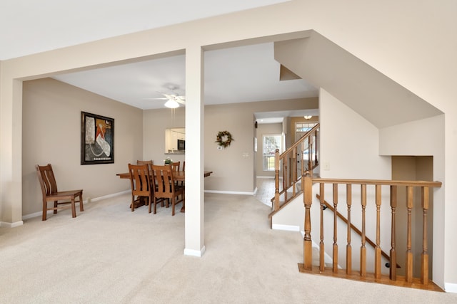 1622 Castle Hill Ln, Fort Wright, KY 41011 - dining area featuring a ceiling fan, light carpet, baseboards, and stairs