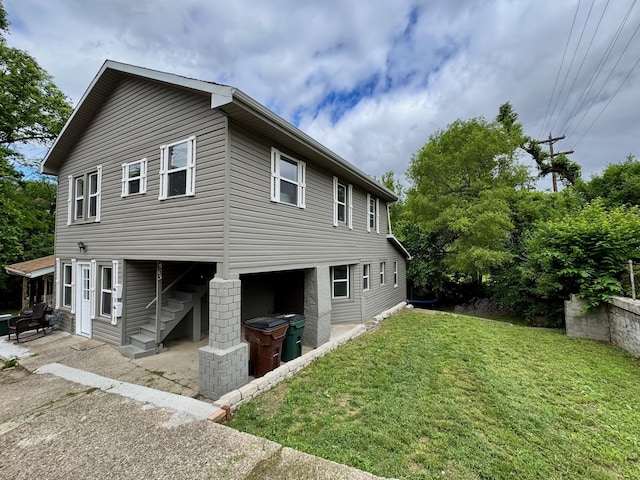 503 W 13th St, Newport, KY 41071 - view of side of property featuring a patio area and a lawn