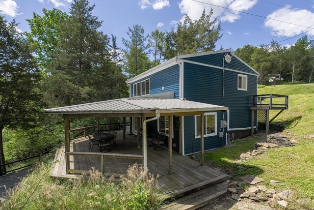 310 Greene Rd, Williamstown, KY 41097 - view of side of home with a wooden deck, a yard, and metal roof