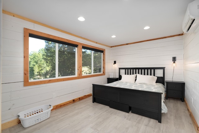 310 Greene Rd, Williamstown, KY 41097 - bedroom with a wall mounted air conditioner, wooden walls, light wood-style flooring, recessed lighting, and baseboards