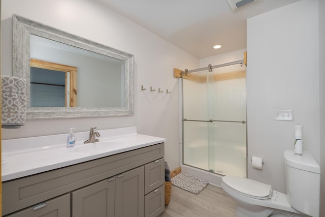 310 Greene Rd, Williamstown, KY 41097 - bathroom with toilet, vanity, a shower stall, and wood finished floors