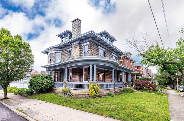 274 Ward Ave, Bellevue, KY 41073 - italianate home featuring covered porch, a front yard, a chimney, and stone siding