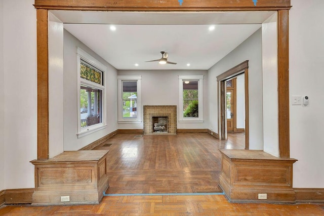 274 Ward Ave, Bellevue, KY 41073 - unfurnished living room featuring a ceiling fan, baseboards, a fireplace, and parquet flooring