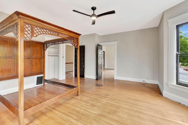 274 Ward Ave, Bellevue, KY 41073 - spare room with light wood finished floors, ceiling fan, baseboards, and radiator heating unit