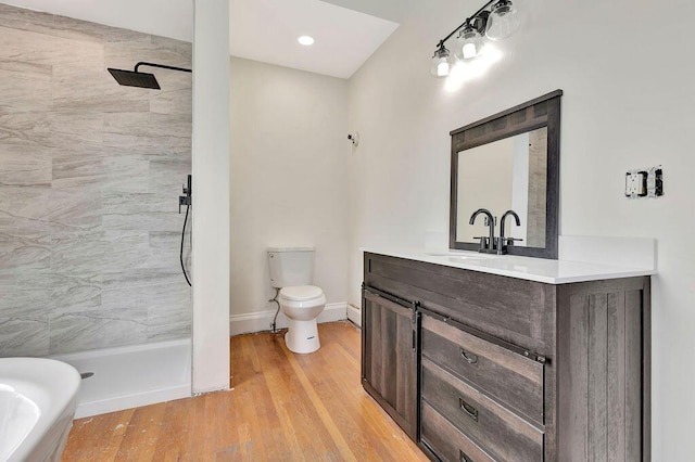 274 Ward Ave, Bellevue, KY 41073 - bathroom with vanity, tiled shower, toilet, and wood finished floors