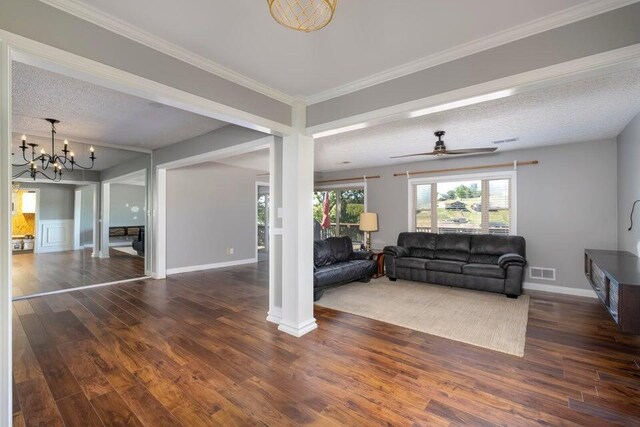 510 Jacob Dr, Williamstown, KY 41097 - living room with wood finished floors, a chandelier, ceiling fan, a textured ceiling, and crown molding