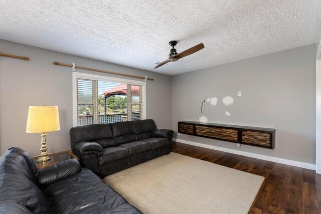 510 Jacob Dr, Williamstown, KY 41097 - living area featuring a ceiling fan, baseboards, dark wood-style flooring, and a textured ceiling