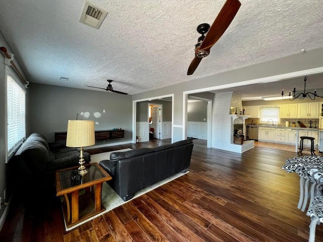 510 Jacob Dr, Williamstown, KY 41097 - living room featuring ceiling fan, dark wood finished floors, a textured ceiling, and wainscoting