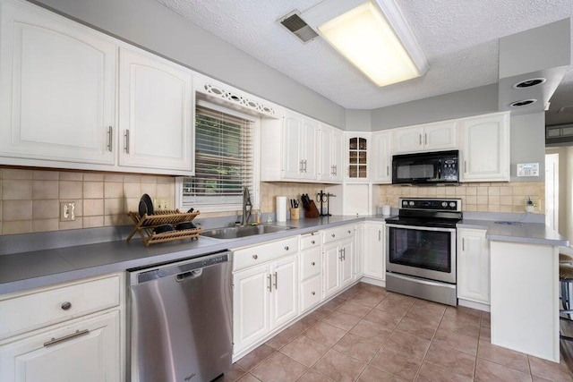 510 Jacob Dr, Williamstown, KY 41097 - kitchen with stainless steel appliances, a sink, white cabinets, a textured ceiling, and light tile patterned floors