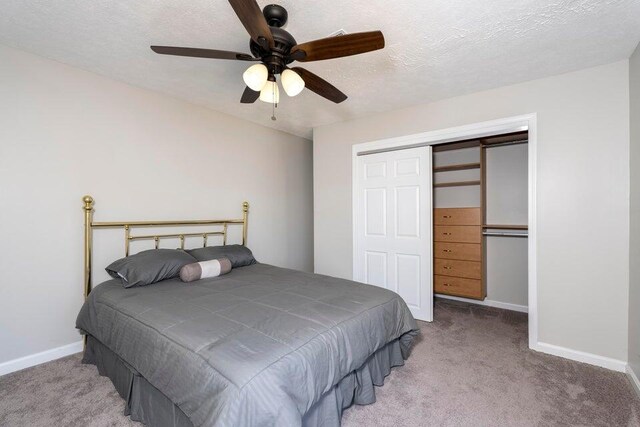 510 Jacob Dr, Williamstown, KY 41097 - carpeted bedroom featuring baseboards, a closet, ceiling fan, and a textured ceiling