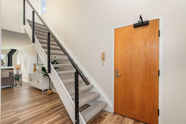 902 Vernon Pl, Covington, KY 41016 - stairs with wood finished floors, baseboards, a towering ceiling, and crown molding