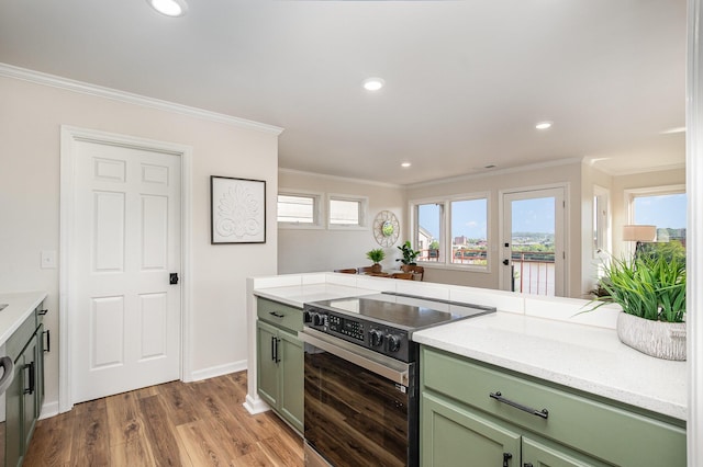 902 Vernon Pl, Covington, KY 41016 - kitchen featuring green cabinets, stainless steel range with electric cooktop, ornamental molding, wood finished floors, and recessed lighting
