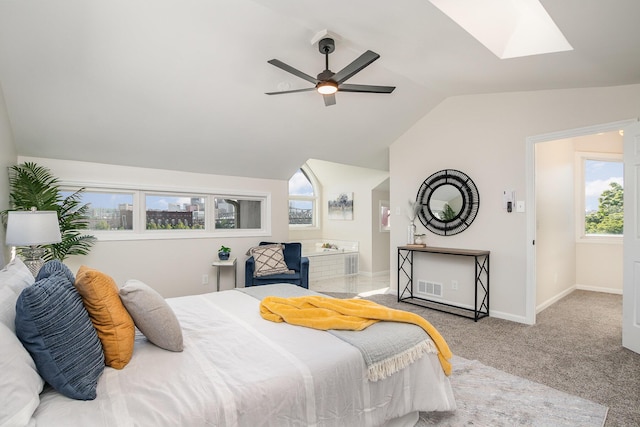 902 Vernon Pl, Covington, KY 41016 - carpeted bedroom with lofted ceiling, a skylight, multiple windows, baseboards, and ensuite bathroom