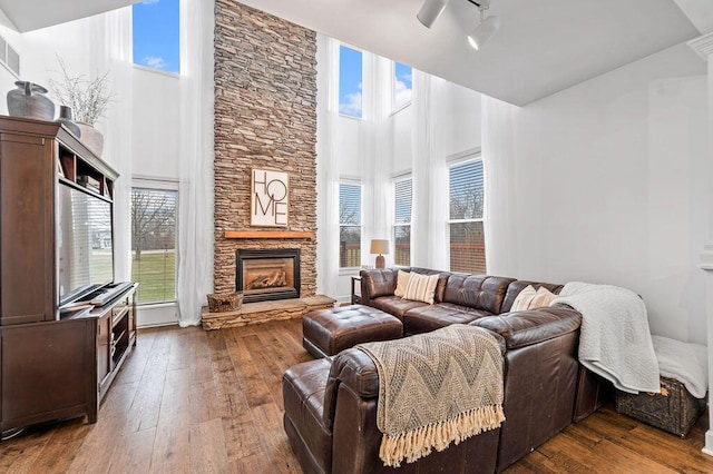 4800 Brewer Ln, Petersburg, KY 41080 - living room with high vaulted ceiling, a fireplace, hardwood / wood-style floors, and plenty of natural light