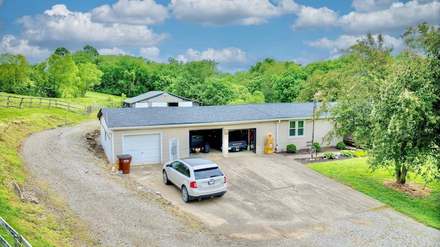12085 Dickerson Rd, Walton, KY 41094 - ranch-style house featuring driveway, a garage, a wooded view, and a shingled roof