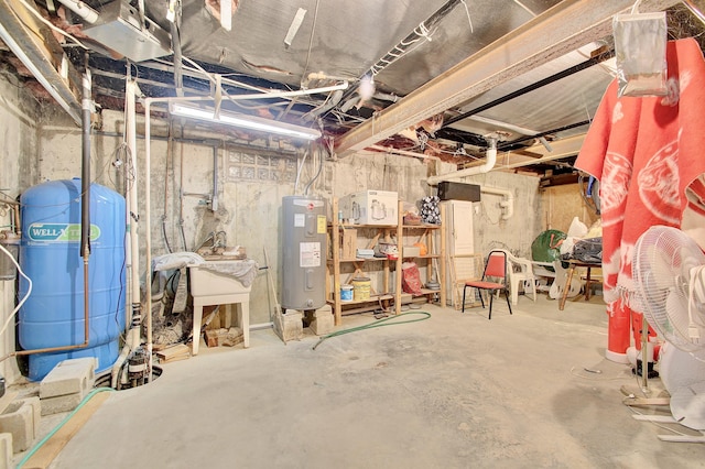 12085 Dickerson Rd, Walton, KY 41094 - unfinished below grade area with water heater and a water pressure tank