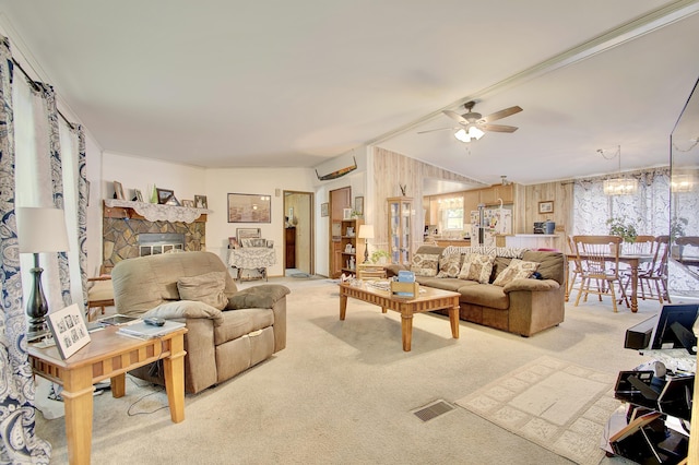 12085 Dickerson Rd, Walton, KY 41094 - living room with carpet floors, ceiling fan, a fireplace, and a chandelier