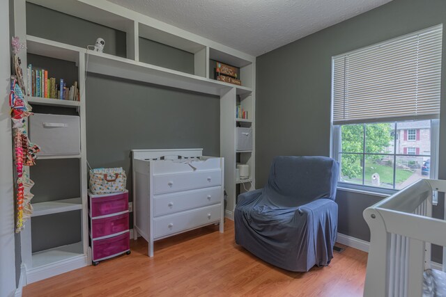 2780 Berwood Ln, Hebron, KY 41048 - bedroom featuring wood finished floors and a textured ceiling