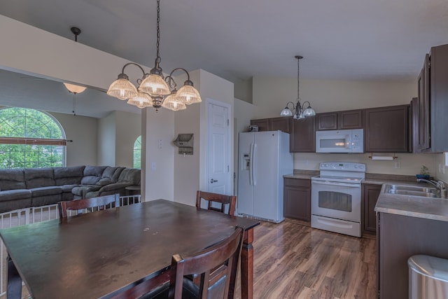 2780 Berwood Ln, Hebron, KY 41048 - kitchen featuring white appliances, a chandelier, lofted ceiling, wood finished floors, and pendant lighting