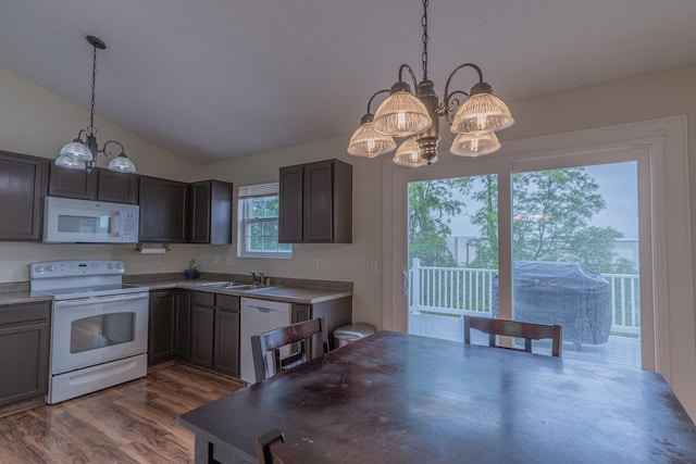 2780 Berwood Ln, Hebron, KY 41048 - kitchen featuring white appliances, a chandelier, vaulted ceiling, dark wood finished floors, and hanging light fixtures