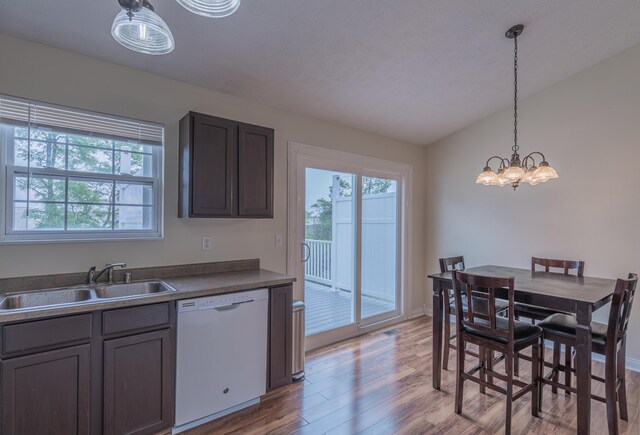 2780 Berwood Ln, Hebron, KY 41048 - kitchen featuring white dishwasher, healthy amount of natural light, light wood-style floors, and a chandelier