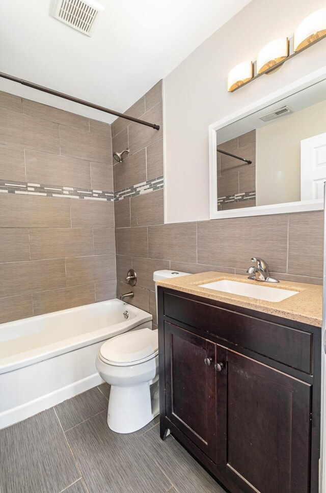 2530 Avon Dr, Crescent Park, KY 41017 - bathroom featuring vanity, tile walls, shower / washtub combination, toilet, and tile patterned flooring