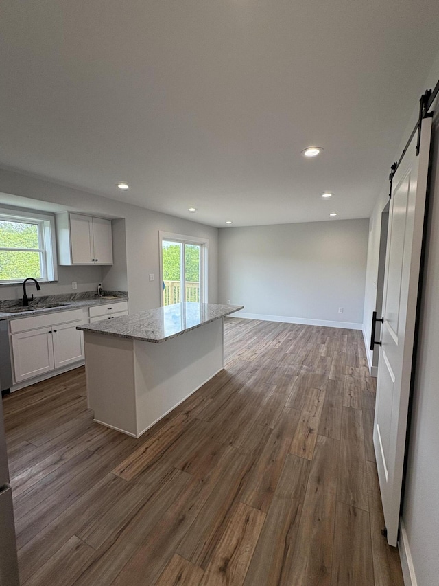 160 Saddlebrook Ln, Dry Ridge, KY 41035 - kitchen with a sink, a barn door, a center island, recessed lighting, and light stone countertops
