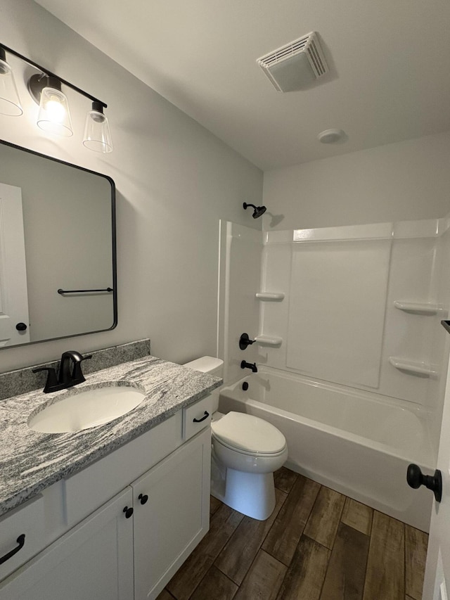 160 Saddlebrook Ln, Dry Ridge, KY 41035 - bathroom featuring wood finished floors, vanity, shower / bathtub combination, and toilet