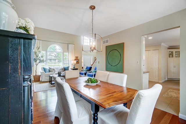 12002 Southridge Dr, Walton, KY 41094 - dining room with a chandelier and wood finished floors