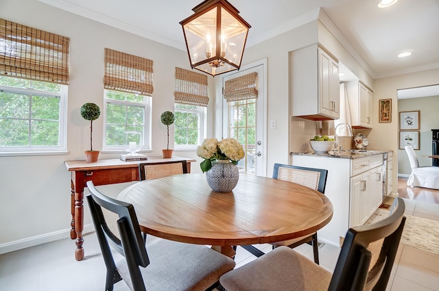 12002 Southridge Dr, Walton, KY 41094 - dining area with healthy amount of natural light, baseboards, a chandelier, light tile patterned floors, and crown molding