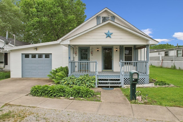 626 E 2nd St, Augusta, KY 41002 - view of front of home with an attached garage, driveway, covered porch, and a front lawn