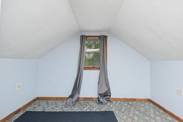 626 E 2nd St, Augusta, KY 41002 - bonus room with baseboards, a textured ceiling, carpet, and lofted ceiling