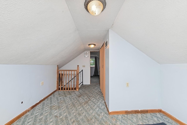 626 E 2nd St, Augusta, KY 41002 - bonus room featuring a textured ceiling, carpet floors, vaulted ceiling, and baseboards