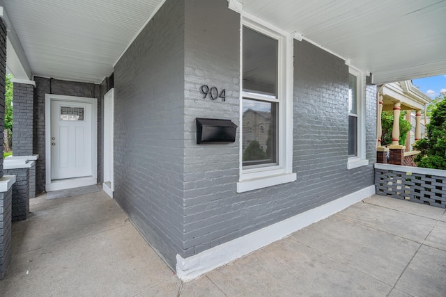 904 5th Ave, Dayton, KY 41074 - property entrance featuring covered porch and brick siding