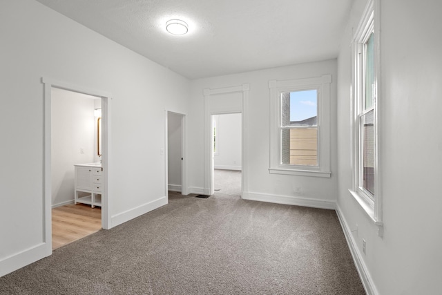 904 5th Ave, Dayton, KY 41074 - unfurnished bedroom with carpet flooring, baseboards, and ensuite bath